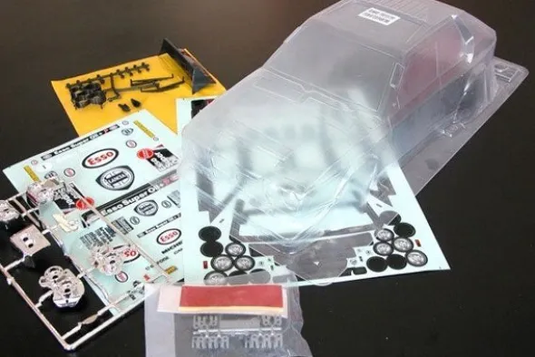 CARROZZERIA TRASPARENTE LANCIA DELTA S4 CON DECALS ESSO - RALLY LEGENDS